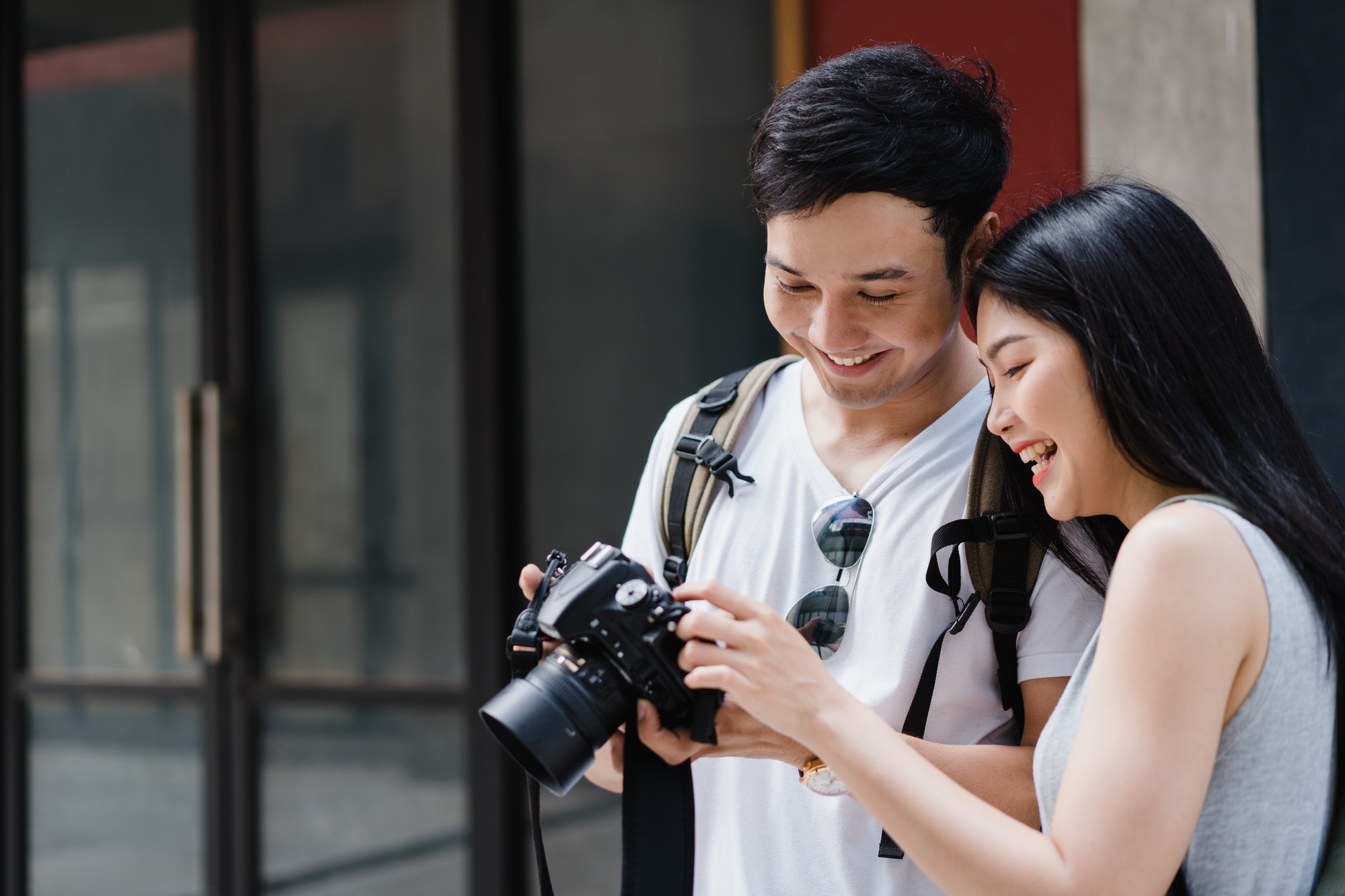asian-couple-using-camera-for-take-a-picture-while-spending-holiday-.jpg